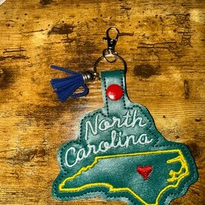 Green North Carolina Keychain with Blue Tassel